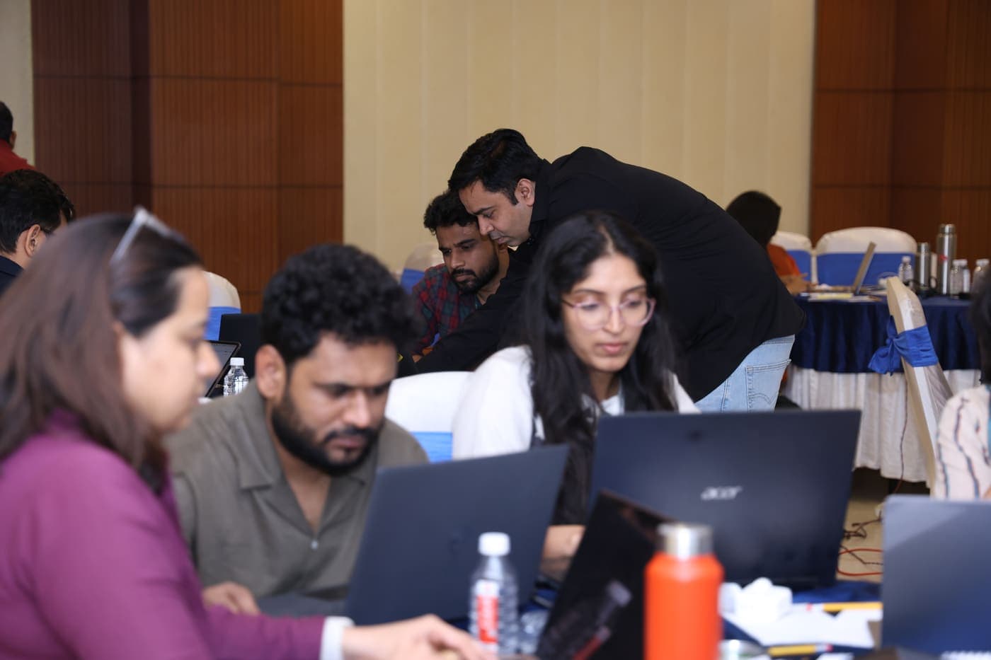 Participants heads-down applying AI to their own work